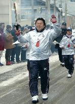 Ex-sumo wrestler Mainoumi carries Asian Games torch